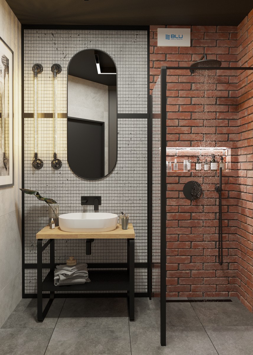 Industrialna łazienka z ceglaną ścianą.